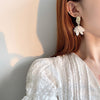 FRAGILE SPLASH - WHITE SHELL FLOWER PETAL DROP EARRINGS